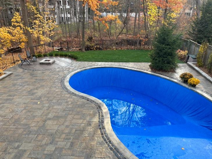 A beautifully landscaped garden with Pool and lush greenery maintenance service.